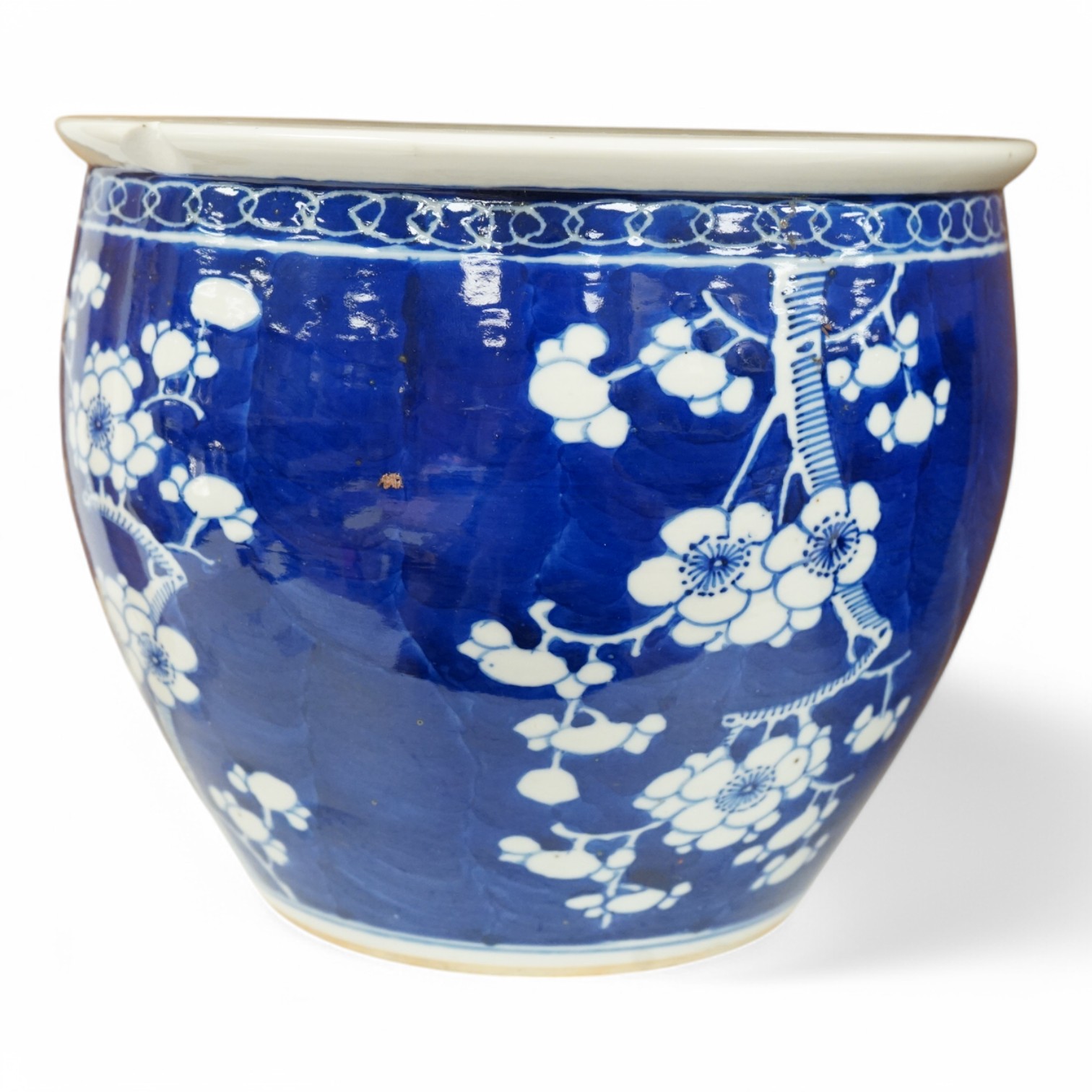 A Chinese blue and white ‘prunus’ jardiniere, 20cm tall. Condition- chipped